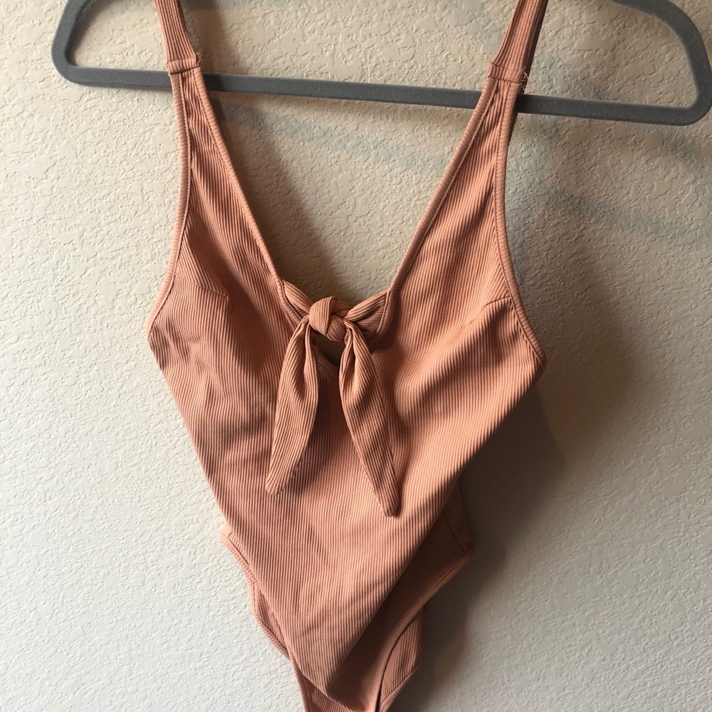 NWT. Size small body suit